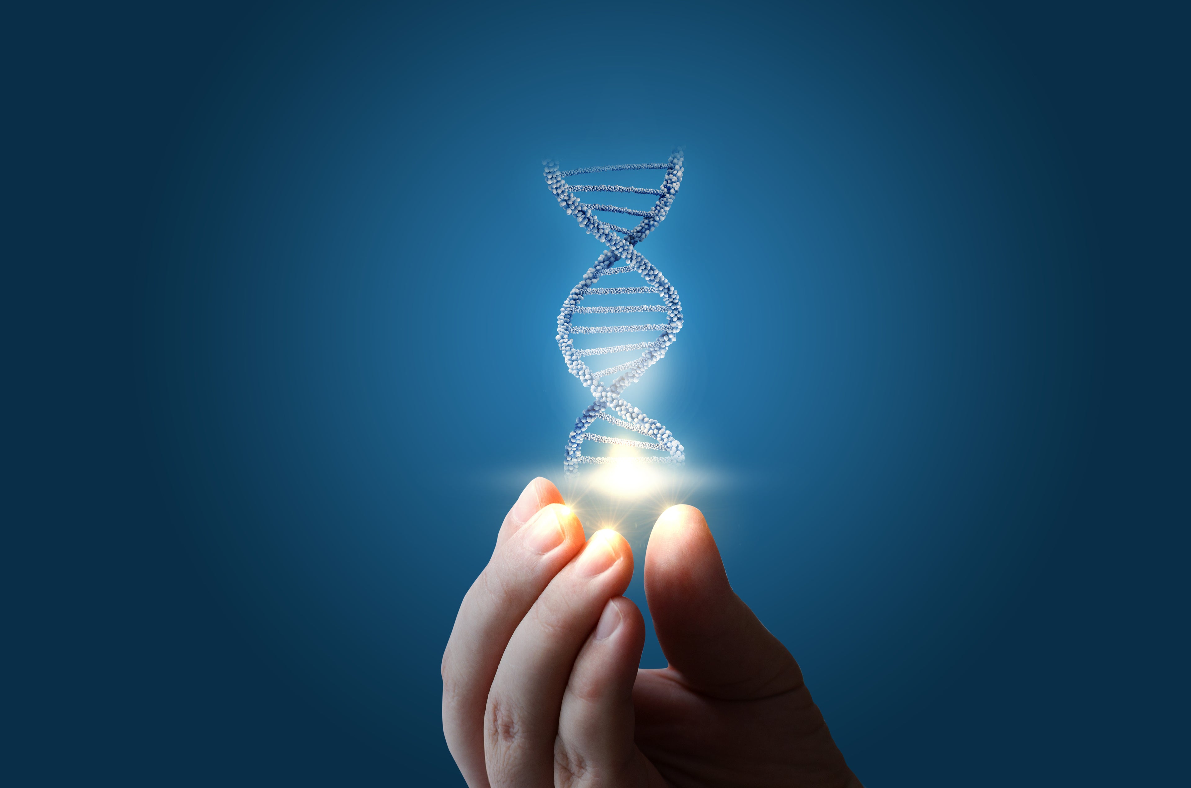 DNA Strand with light held between fingers
