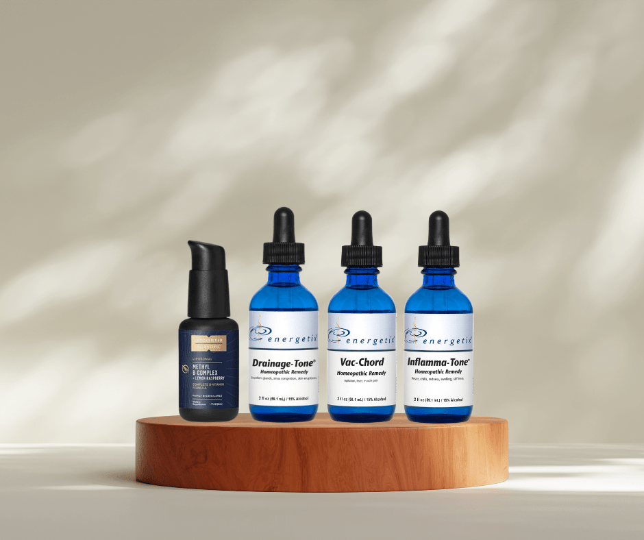 Four blue skincare bottles on a wooden stand with a neutral background